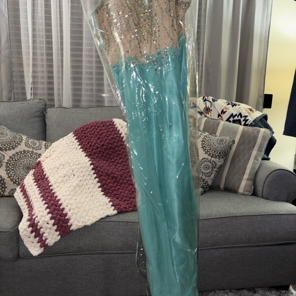 Vibrant Blue Prom Dress with Shimmery Fabric and Floor-Length Silhouette